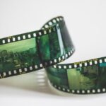 Close-up of a vintage AGFA filmstrip with cinematic exposures, evoking nostalgia.